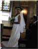 Bride with bouquet and ceremonial crown.